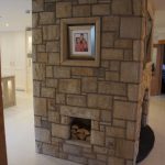 Fireplace With Built In Log Holder And Sandstone Frame Surround