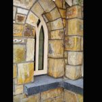 Rock Faced Limestone Cills. Arch Detail On Window