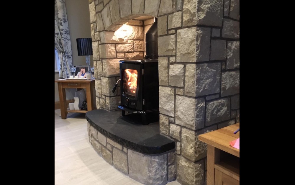 Curved Rock faced limestone hearth