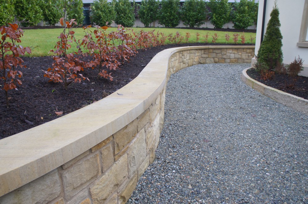 Curved Donegal Sandstone smooth wall copings