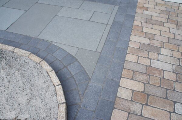 Grey Limestone with a tumbled black limestone border